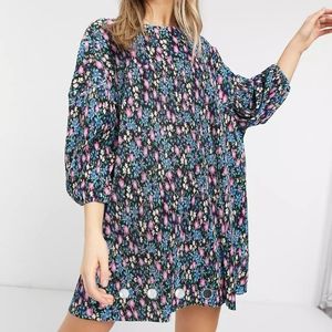 ASOS DESIGN plisse smock mini dress in black based floral print